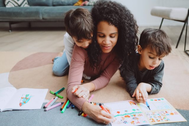 Journal prompts for kids and adults to do together. Mother and her children are drawing together